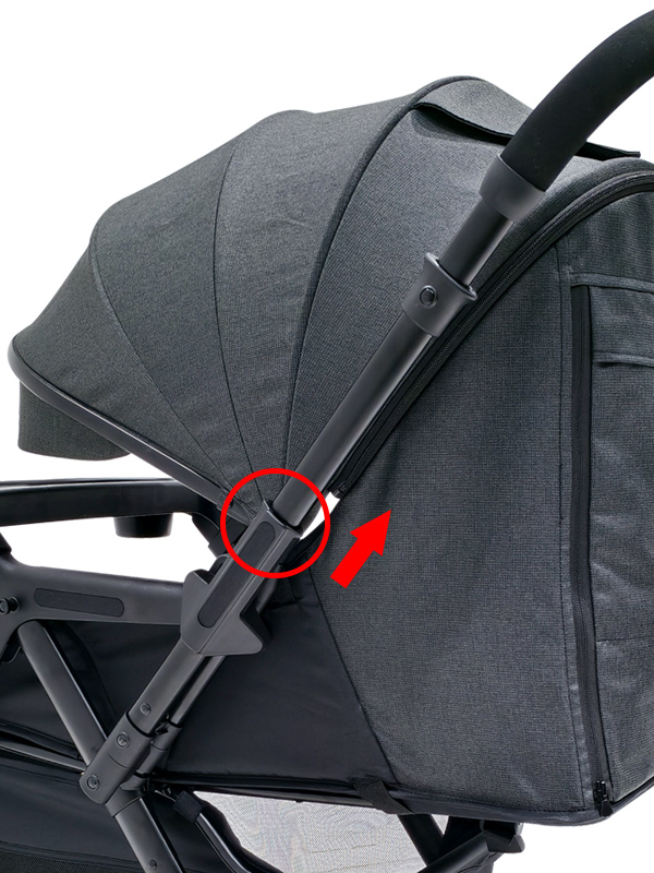 Baby stroller reversing button